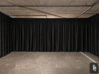Black pipe and drape installed across an event space with Sound and Video Rentals logo