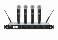 Shure ULXD4Q receiver with four upright ULXD2 handheld microphones and two antennas