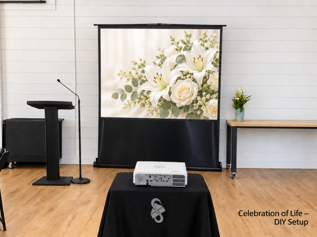 Celebration of life DIY rental setup with projector, floral memorial screen and podium