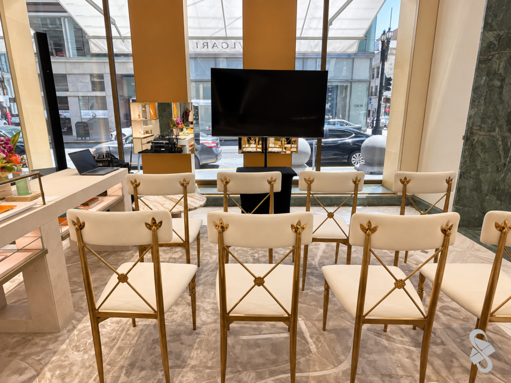 TV display, column speaker and seating for an AV event setup in a San Francisco store